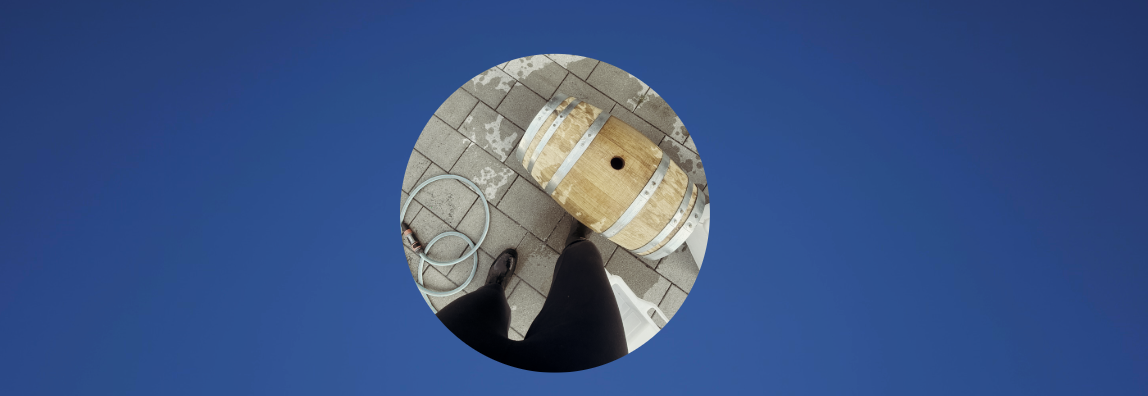 a picture of a barrel being washed on concrete ground